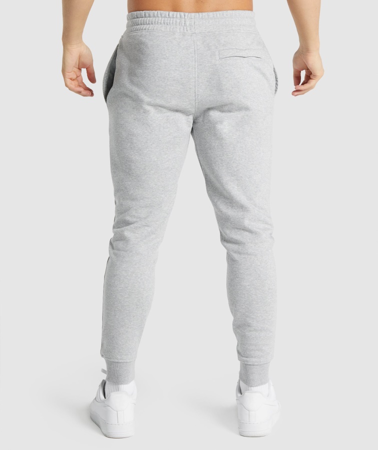 Joggers Gymshark Gris Claro Core Jaspeado Con Escudo